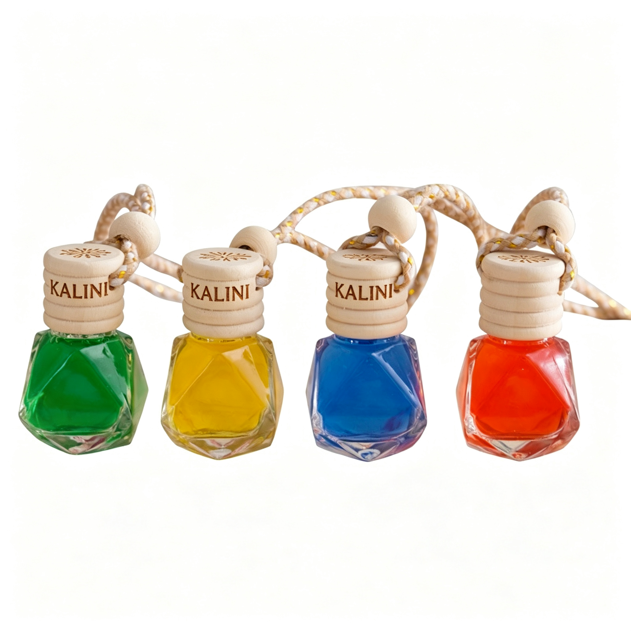 Four KALINI faceted car diffuser bottles with ribbed wooden caps and hanging cords, shown with coloured liquid