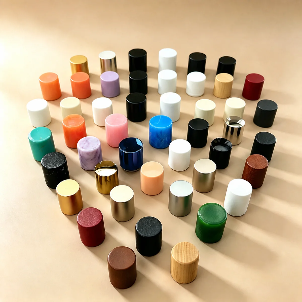 Perfume bottle caps in multiple material and finish directions