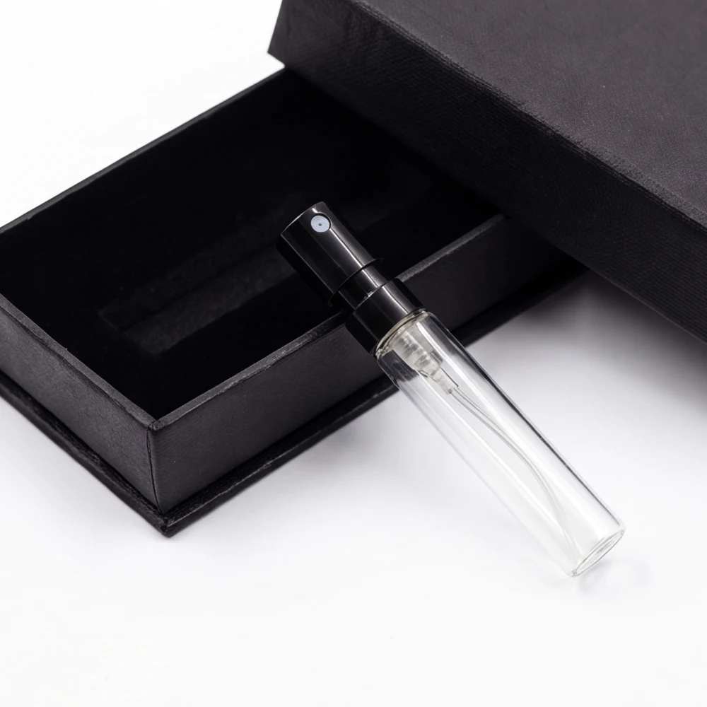 One 2ml perfume sample vial shown with a fitted black presentation box