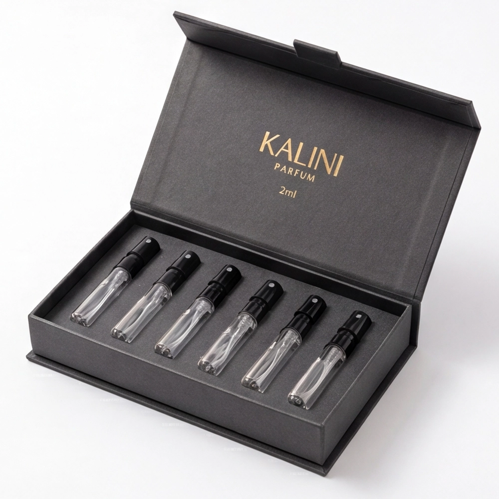 Six perfume sample vials in an open black hinged presentation box